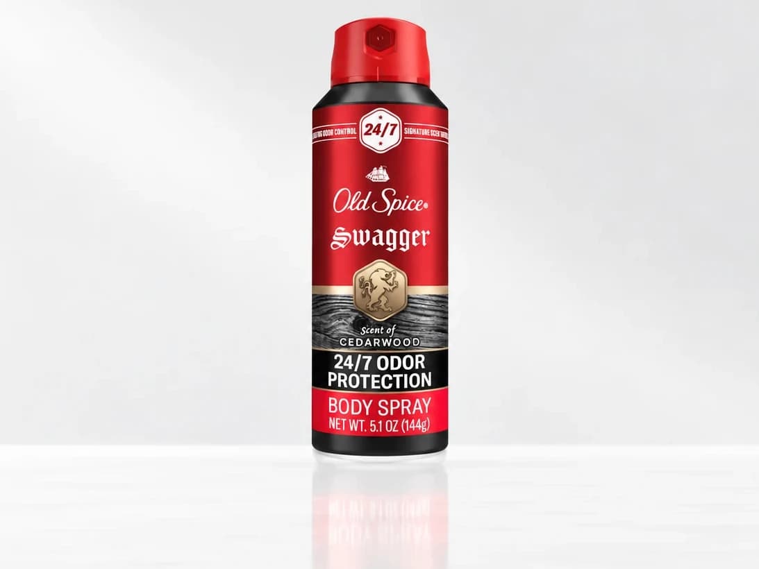 The client's red body spray can on a plain white background